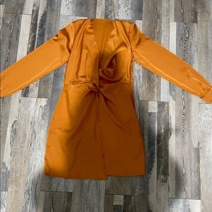 It's a beautiful orange dress, worn once.